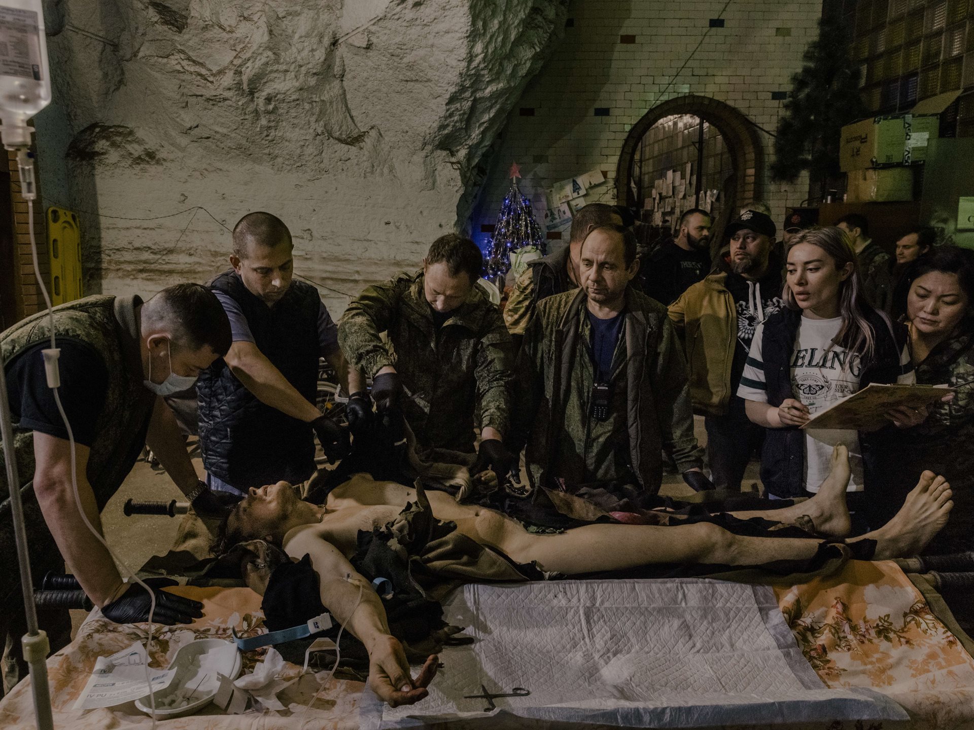 <p>A wounded Ukrainian man who was conscripted to fight for Russia at a field hospital in an underground winery in the Bakhmut region, near Donbas, Ukraine. His left leg and arm were later amputated.</p>
